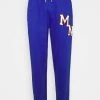 Mennace UNISEX BADGE - Tracksuit Bottoms - Blue