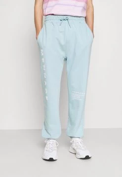 MENNACE SUNDAZE FACE - Tracksuit Bottoms - Light Blue