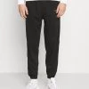 Mennace ESSENTIAL REGULAR JOGGER UNISEX - Tracksuit Bottoms - Black