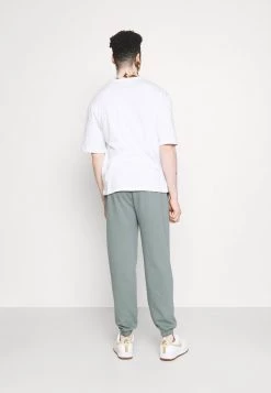 MENNACE ESSENTIAL REGULAR UNISEX - Tracksuit Bottoms - Teal 9 MENNACE ESSENTIAL REGULAR UNISEX - Tracksuit Bottoms - Teal -Mennace Shop Online 9286601fd57947148c28722254d53c87