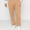 Mennace UNISEX - Tracksuit Bottoms - Brown