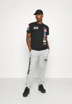 Mennace PETROL BADGE REGULAR UNISEX - Print T-shirt - Black -Mennace Shop Online fcdb0b7475e54974add54b858b7d8152